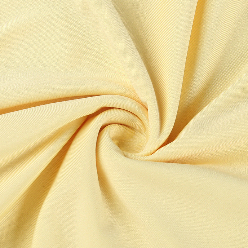 Yellow Mini Dress with Ruffles and a Flower