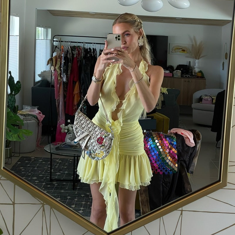 Yellow Mini Dress with Ruffles and a Flower