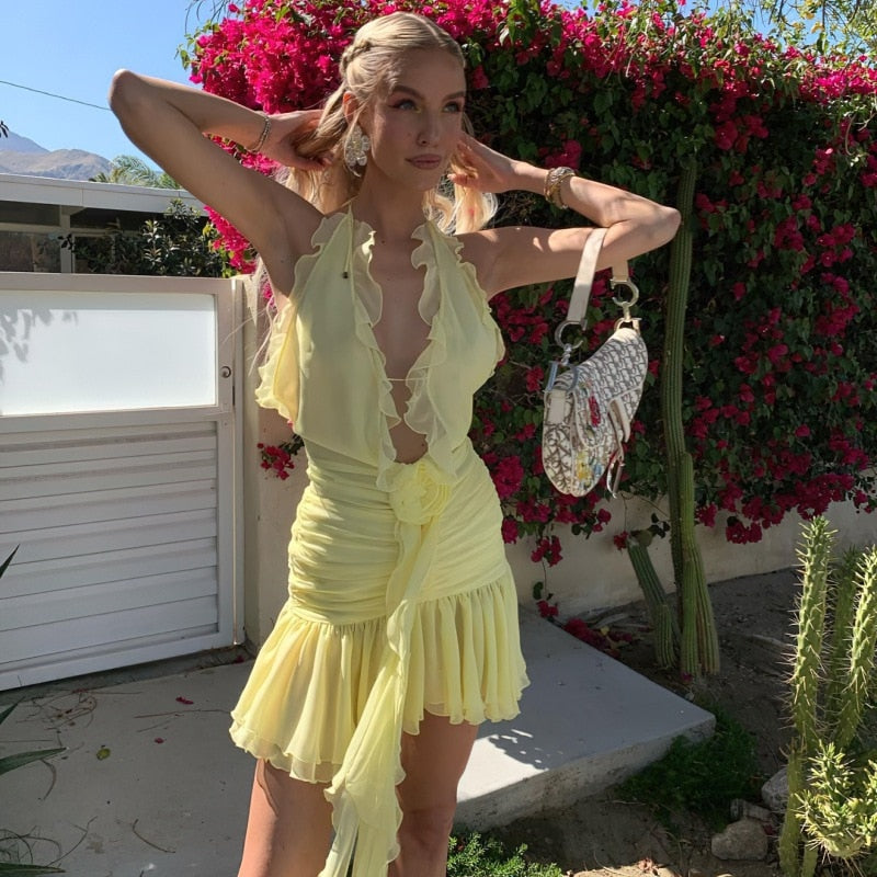 Yellow Mini Dress with Ruffles and a Flower