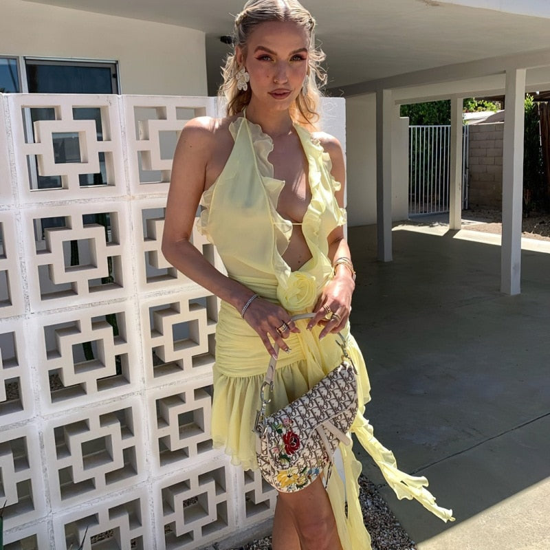 Yellow Mini Dress with Ruffles and a Flower